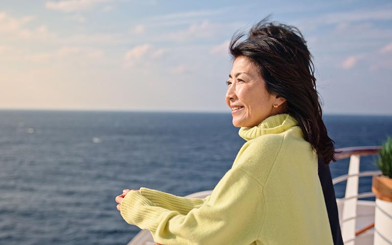 Couple enjoying the view from a cruise ship balcony
